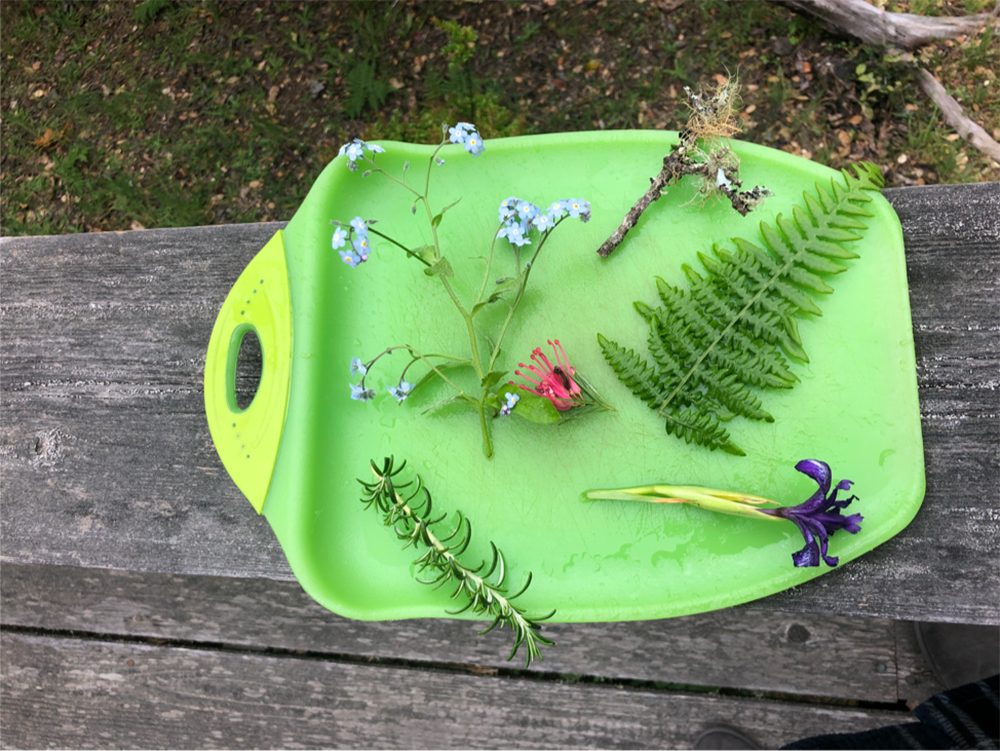 Picture of flowers on a cutting board. 